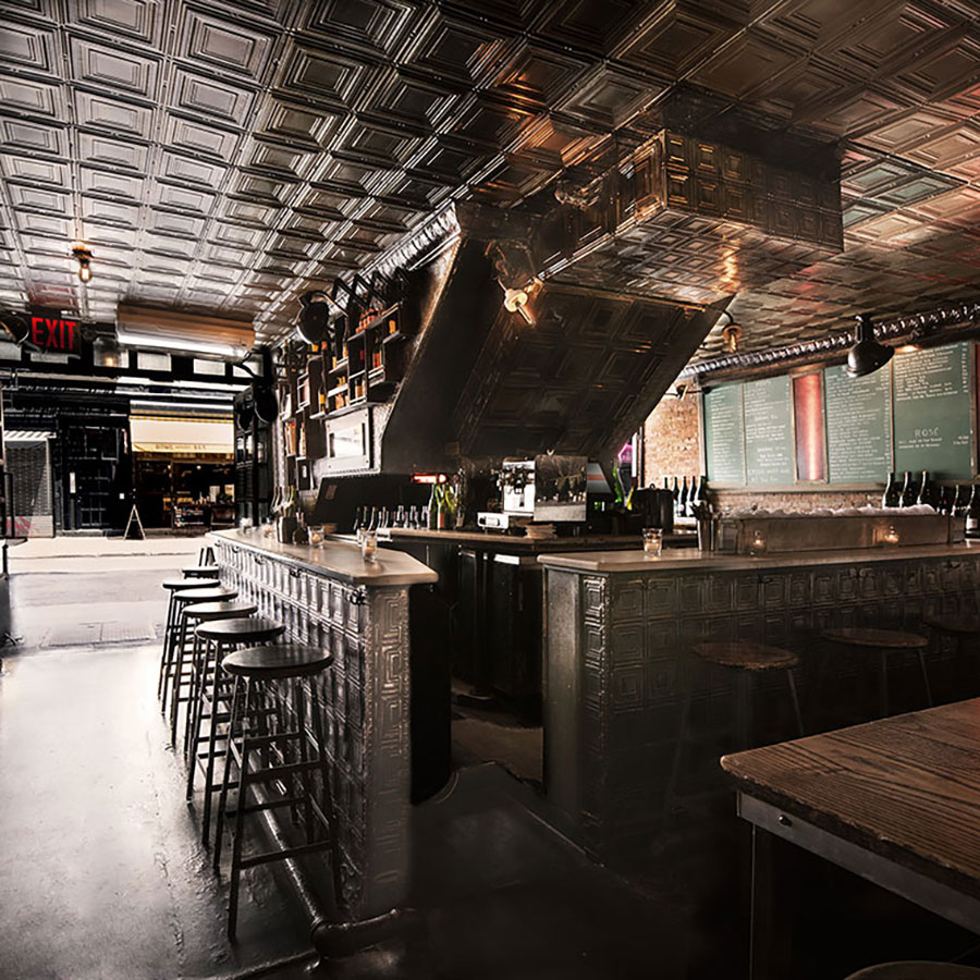 Ten Bells Wine Bar seating area with stools and a table