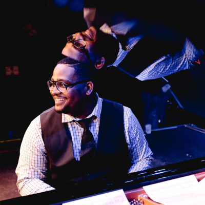 Headshot of Keith Brown performing on the piano