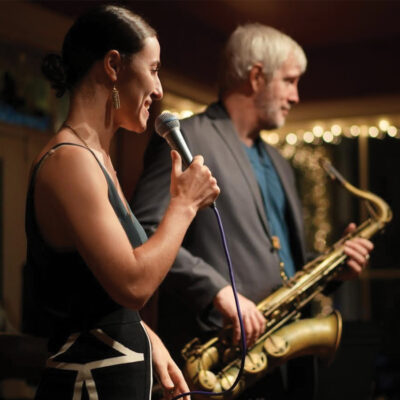 A picture of Lucy Yeghiazaryan with Grant Stewart for their live performance at the django