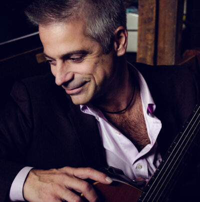a headshot of Guitarist Sean Harkness for his live performance at the Roxy bar