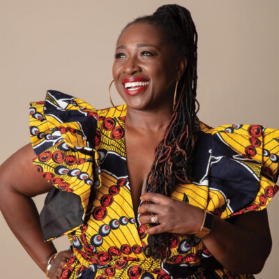 Image of the vocalist, Abena Koomson-Davis, smiling