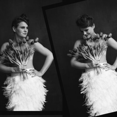 Jazz singer Sarah King posing while holding flowers