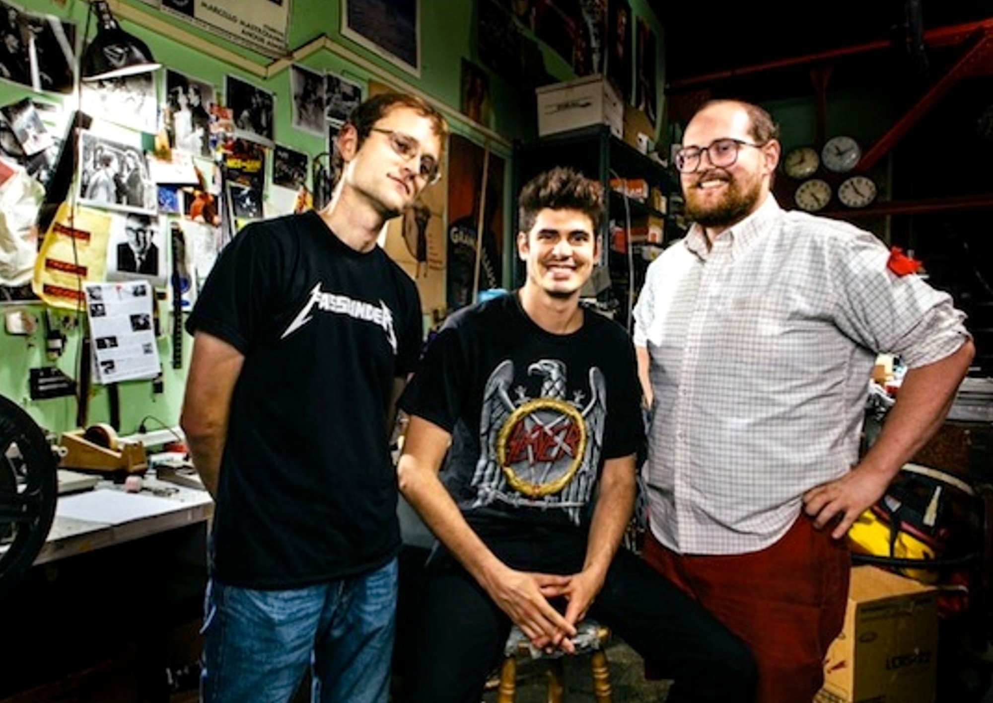 A trio of men standing